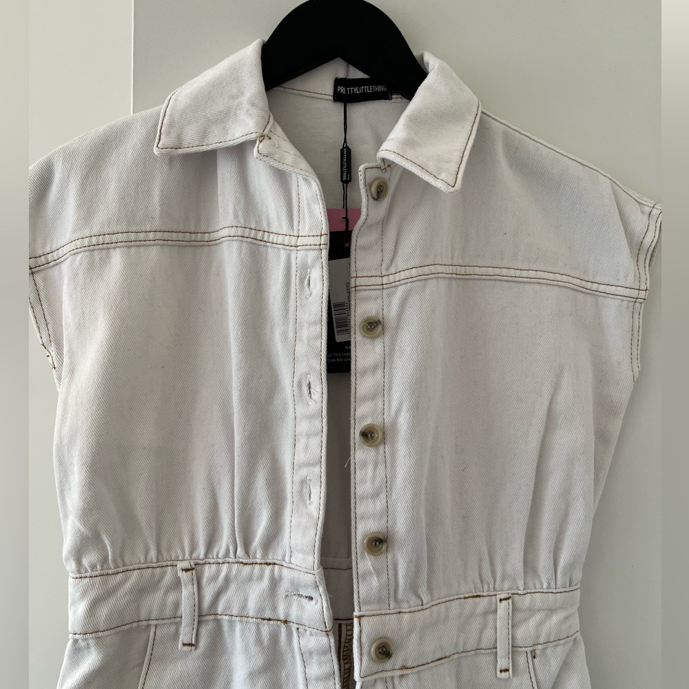 White denim mini dress with buttons.